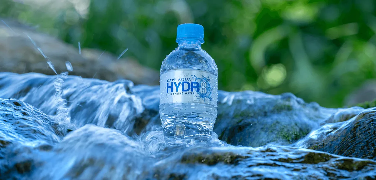 Cape Aqua Hydr8 bottle in natural stream